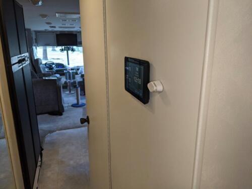 Side view of the Waiter ECC touchscreen mounted on the wall